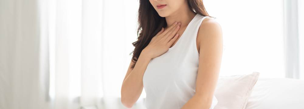 Woman suffering from GERD pain